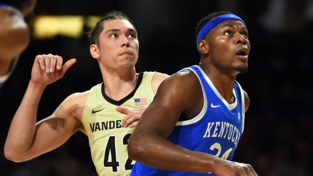 Jan 24, 2023; Nashville, Tennessee, USA; Kentucky Wildcats forward Oscar Tshiebwe (34) and Vanderbilt Commodores forward Quentin Millora-Brown (42) work for positioning on a free throw during the first half at Memorial Gymnasium. Mandatory Credit: Christopher Hanewinckel-USA TODAY Sports